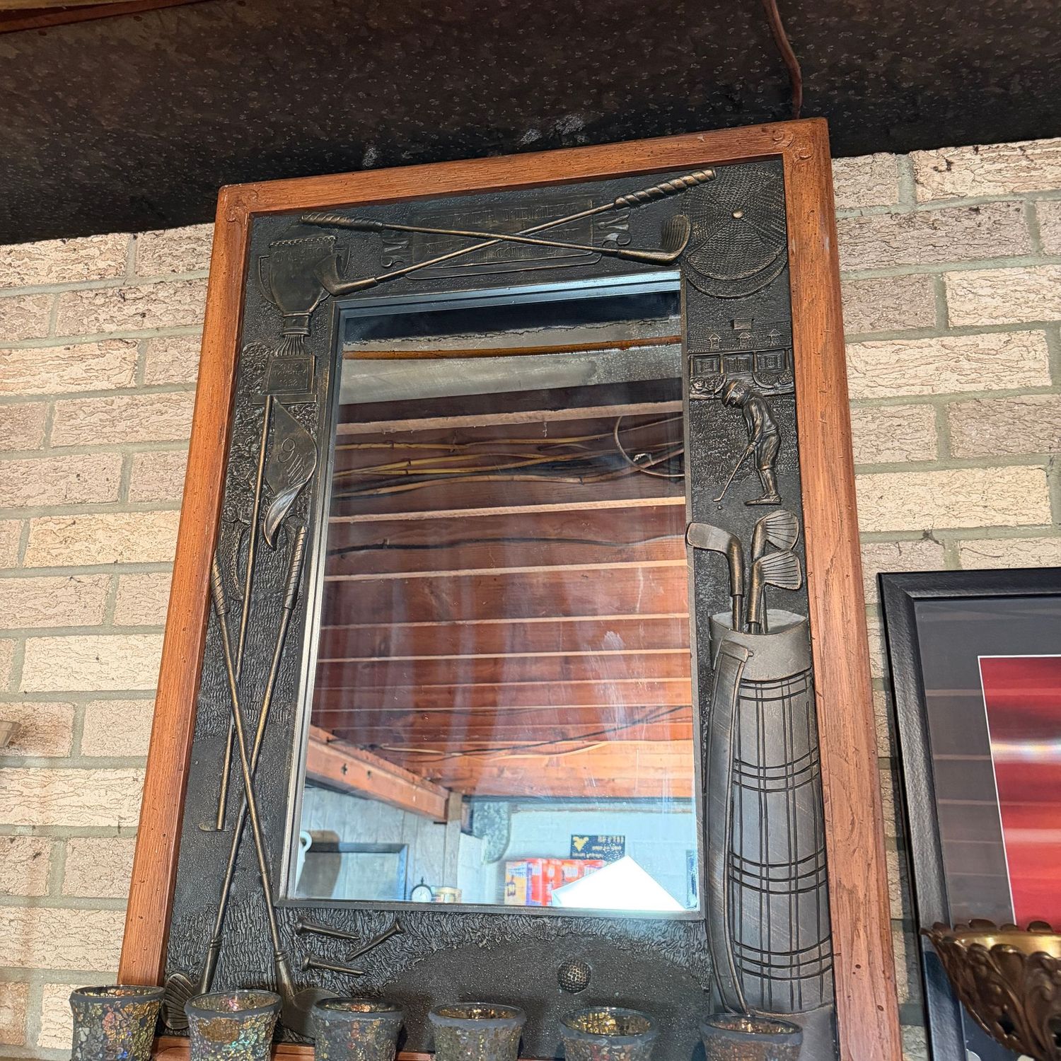 Large golf-themed mirror with molded plastic border, 38" x 25"