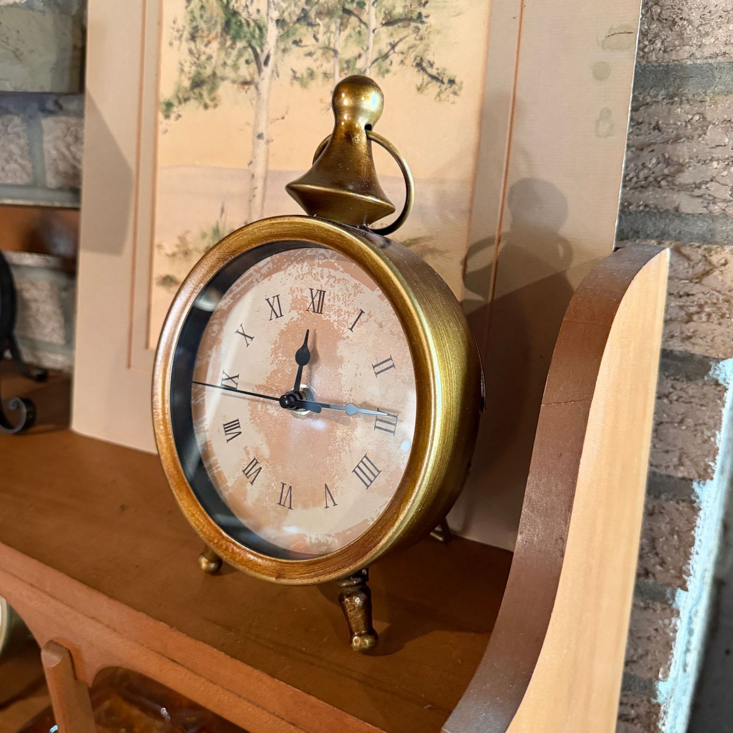 Battery-operated clock with finial top, bar-rest support, 8.5"H