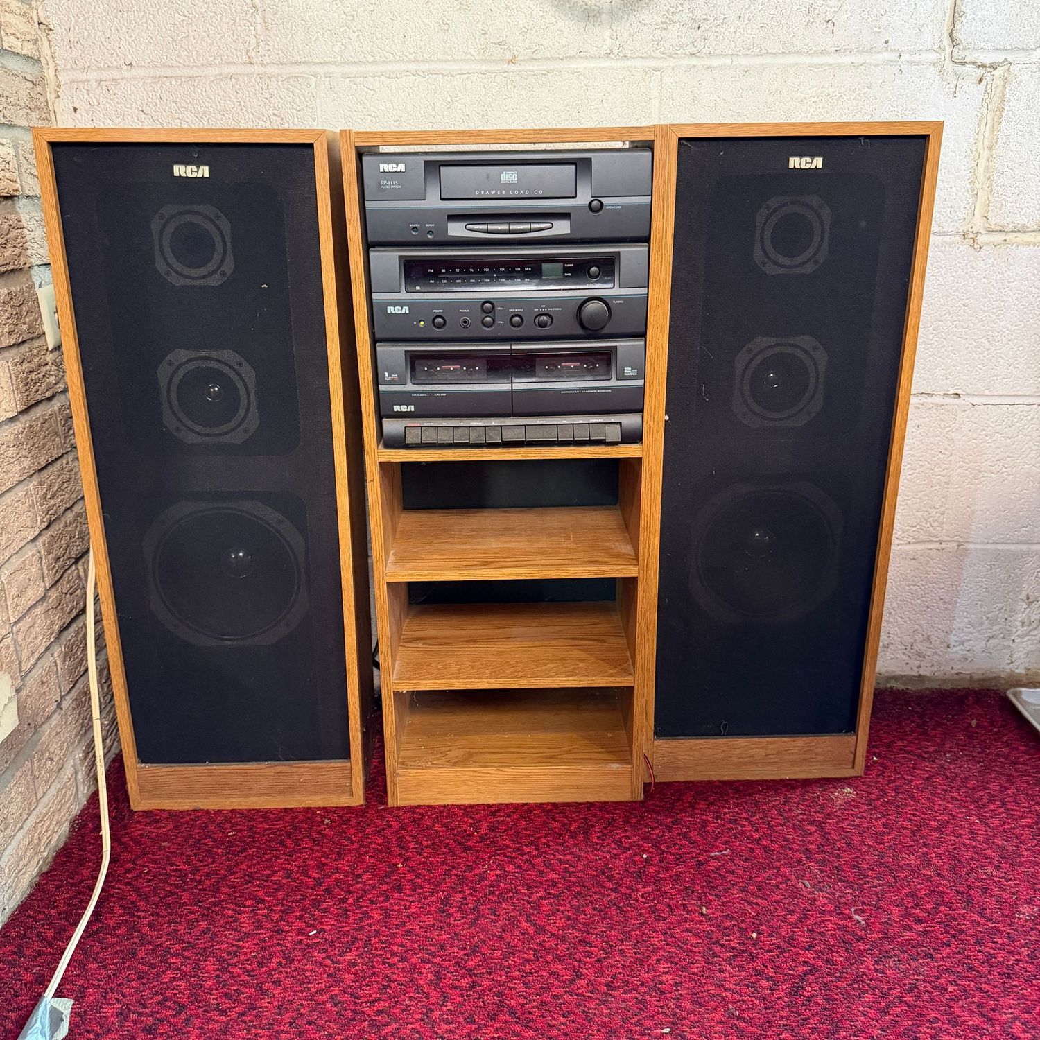 RCA RP-9115 stereo system with stand and speakers, not fully tested but speakers and radio work very well, stand and speakers are 30"H and about 12"W each section (in Lower Level)