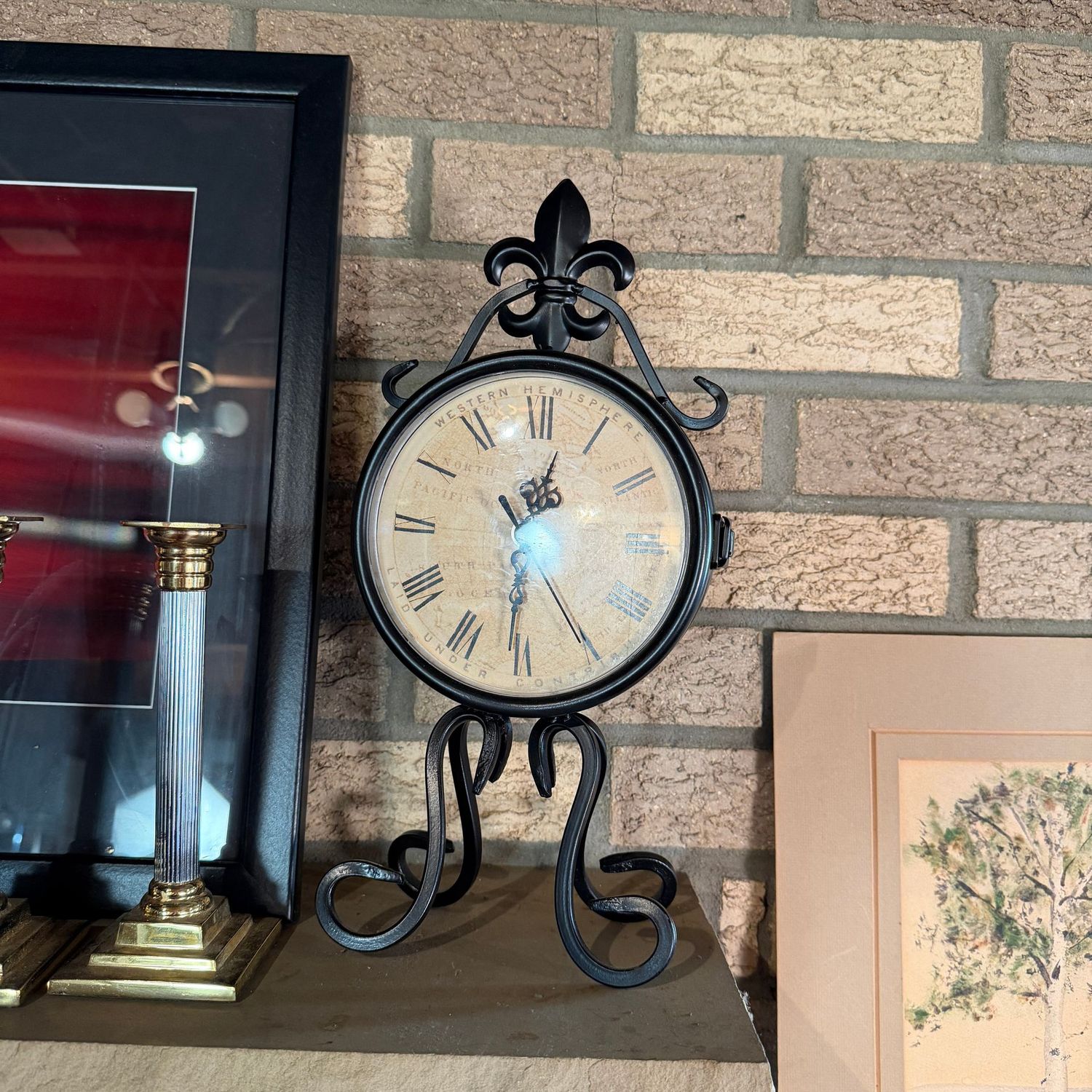Battery-operated clock with face on each side, scrolled legs and fleur-de-lis top, (mantle) 14"H