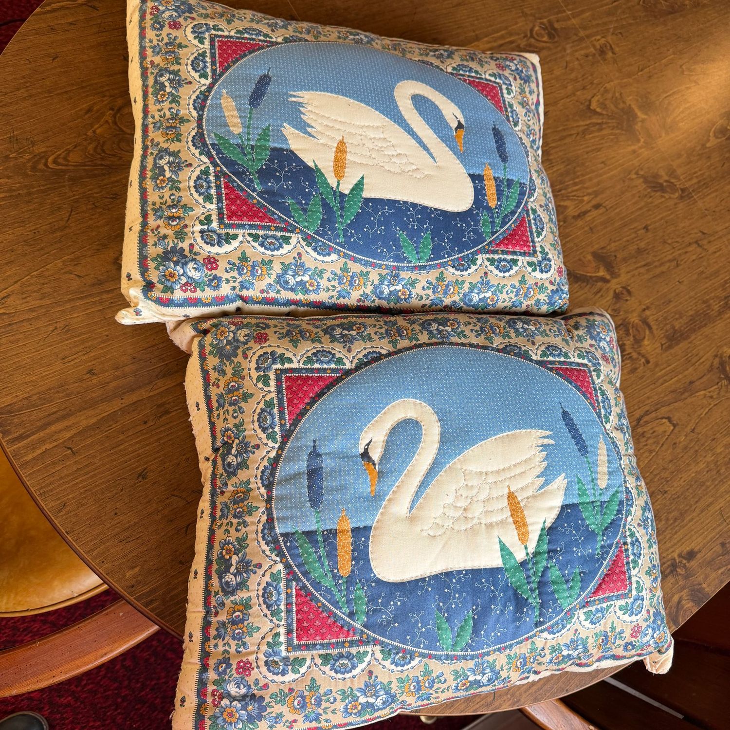 Pair of quilted swan pillows, 16"W