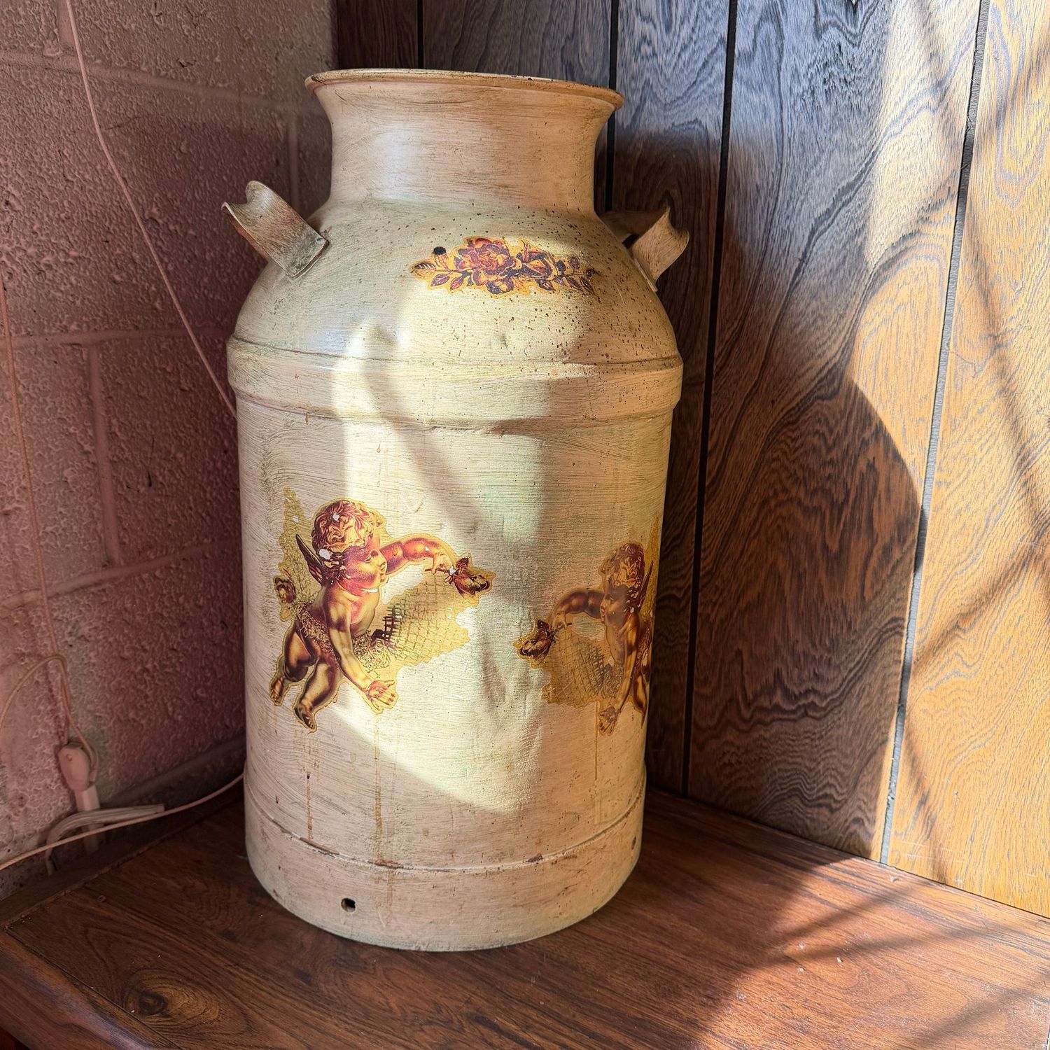 Follansbee milk can with tan glaze and cherub decals, some wear, 23"H