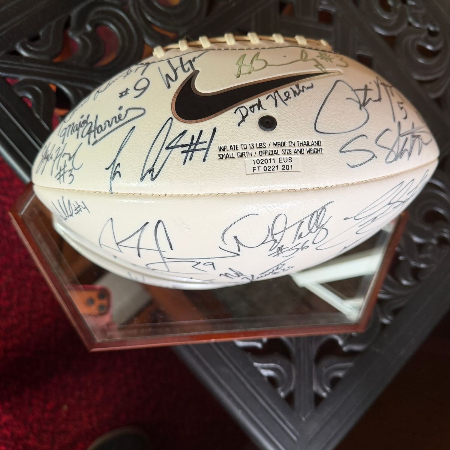Football in case #10 WVU with multiple signatures including Don Nehlen, Major Harris, Geno Smith, Pat White, S. Slaton, D. Talley, White Brothers, & More