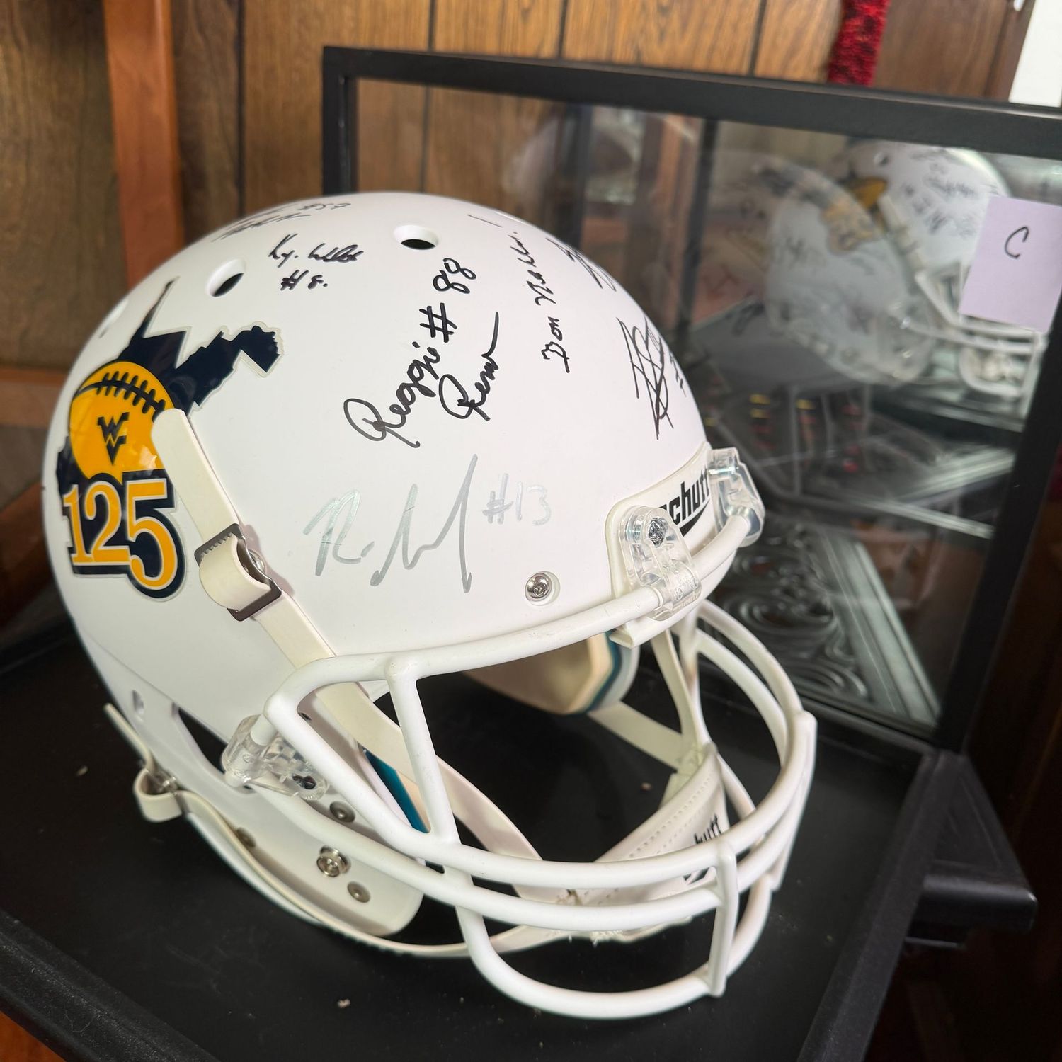 Autographed Full-Size Football Helmet in Case C, Don Nehlen, Reggie Rembert, Major Harris, The White Brothers, Pat White, Orlosky, Grier, and more.