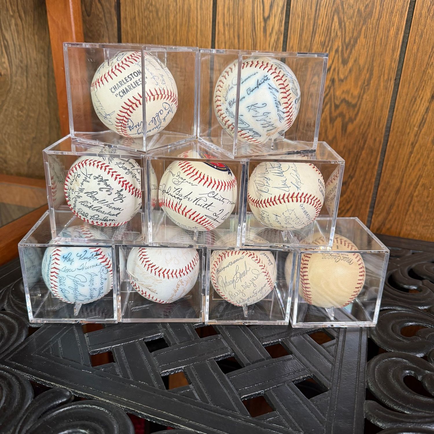 Group of vintage baseballs (most are machine-signed), in display cases
