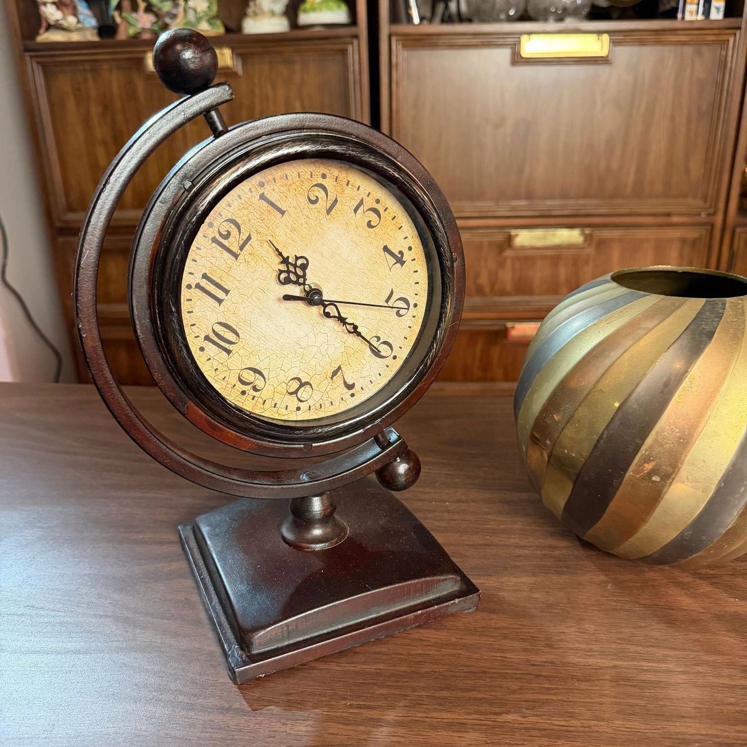 Battery-operated clock on tilted axis, 12"H