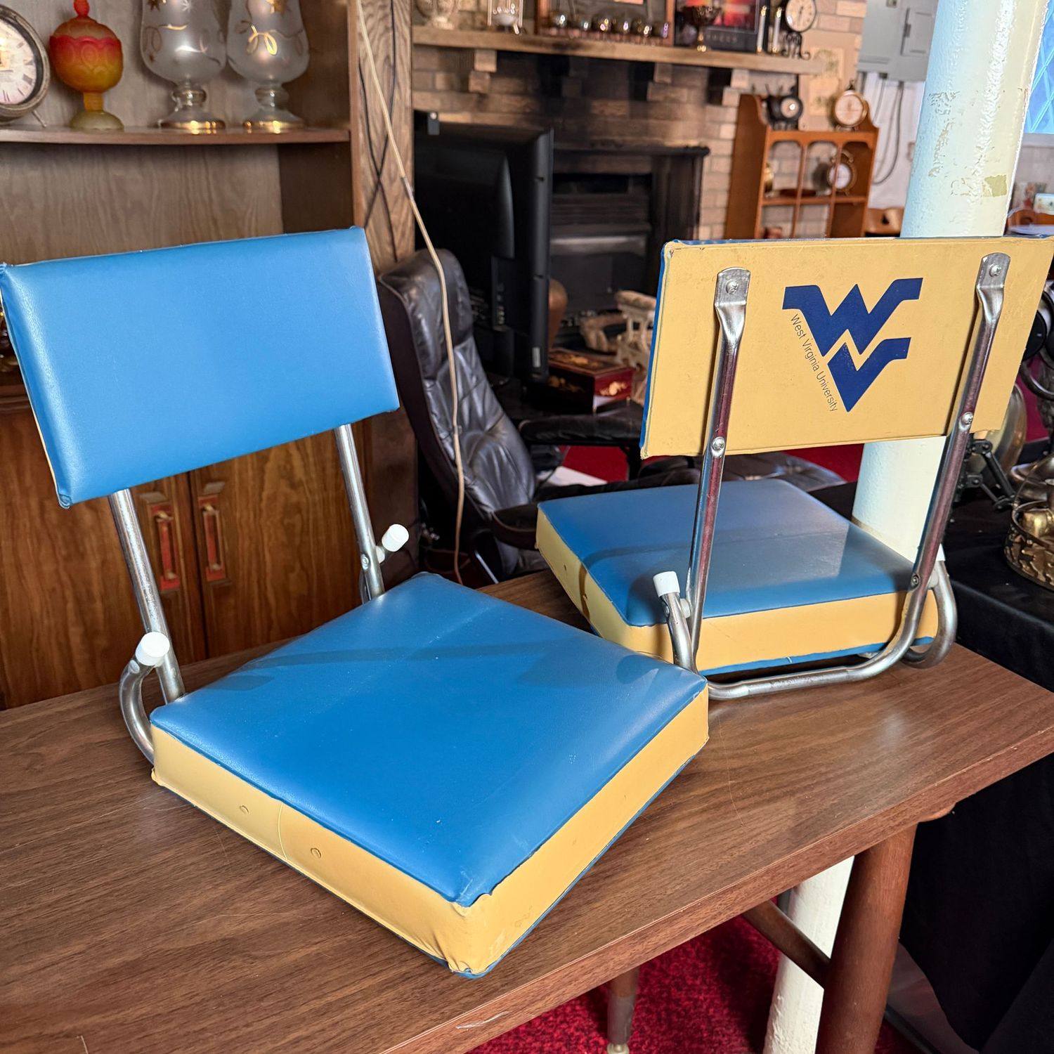 Pair of vintage WVU blue and gold vinyl folding bleacher chairs