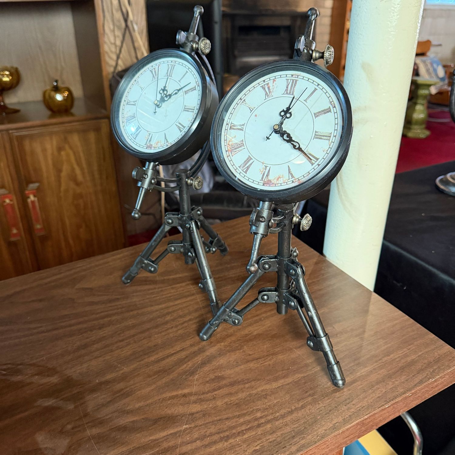 Pair of battery-operated clocks, tilted axis with tripod base, 15"H