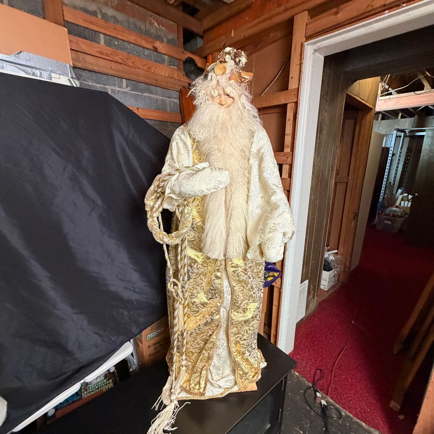 Tall Santa decoration with gold outfit, floral crown, wood base, 4"H