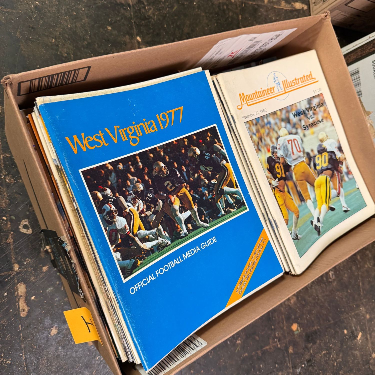 WVU/Sports Ephemera Box #1 includes dozens of vintage sports magazines dating back to the late 1970s (This item is heavy & in the lower level)