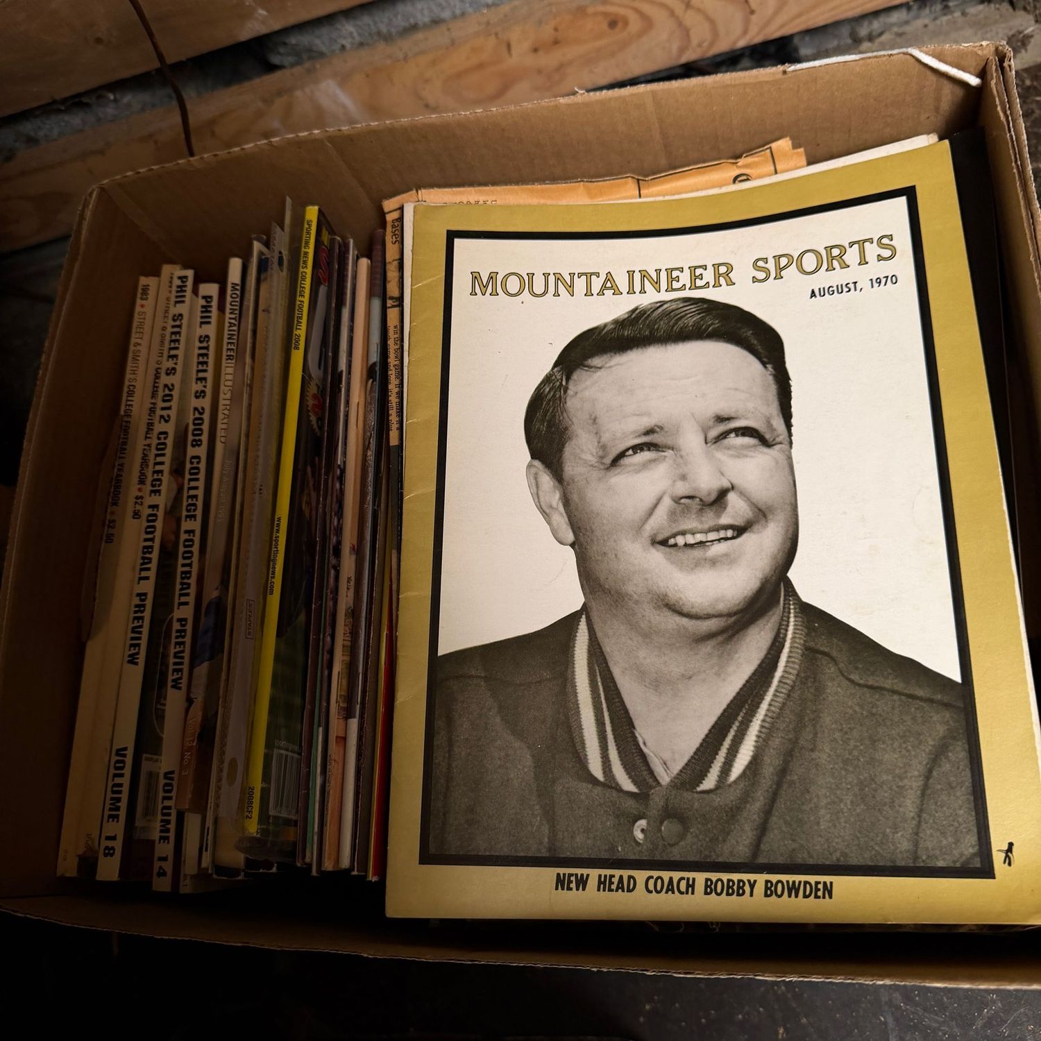 WVU/Sports Ephemera Box #2 magazines dating back to the early 1970s (This item is heavy & in the lower level)