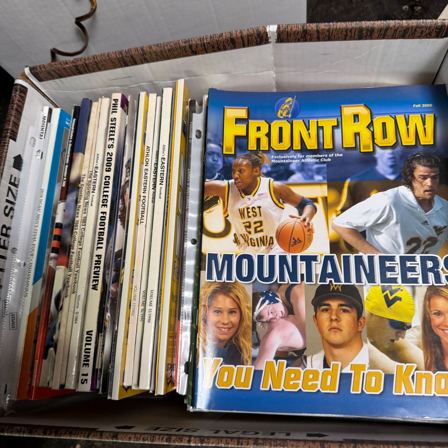 WVU/Sports Ephemera Box #3 magazines from the late 1990s to the early 2000's (This item is heavy & in the lower level)
