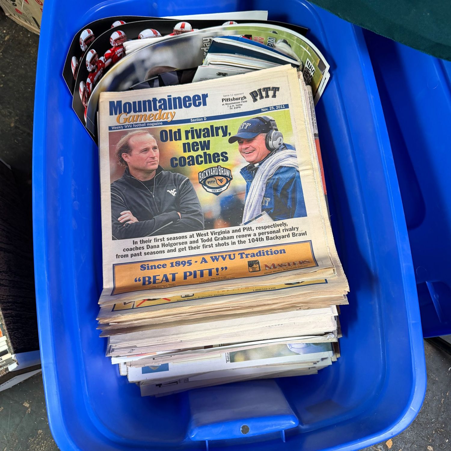WVU/Sports Ephemera Box #4 blue bin full of newspapers from the early 2000s (This item is heavy & in the lower level)