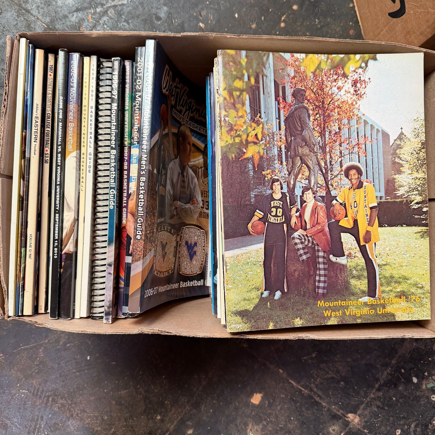 WVU/Sports Ephemera Box #9 Magazines and guides dating back to the early 1970s (This item is heavy & in the lower level)