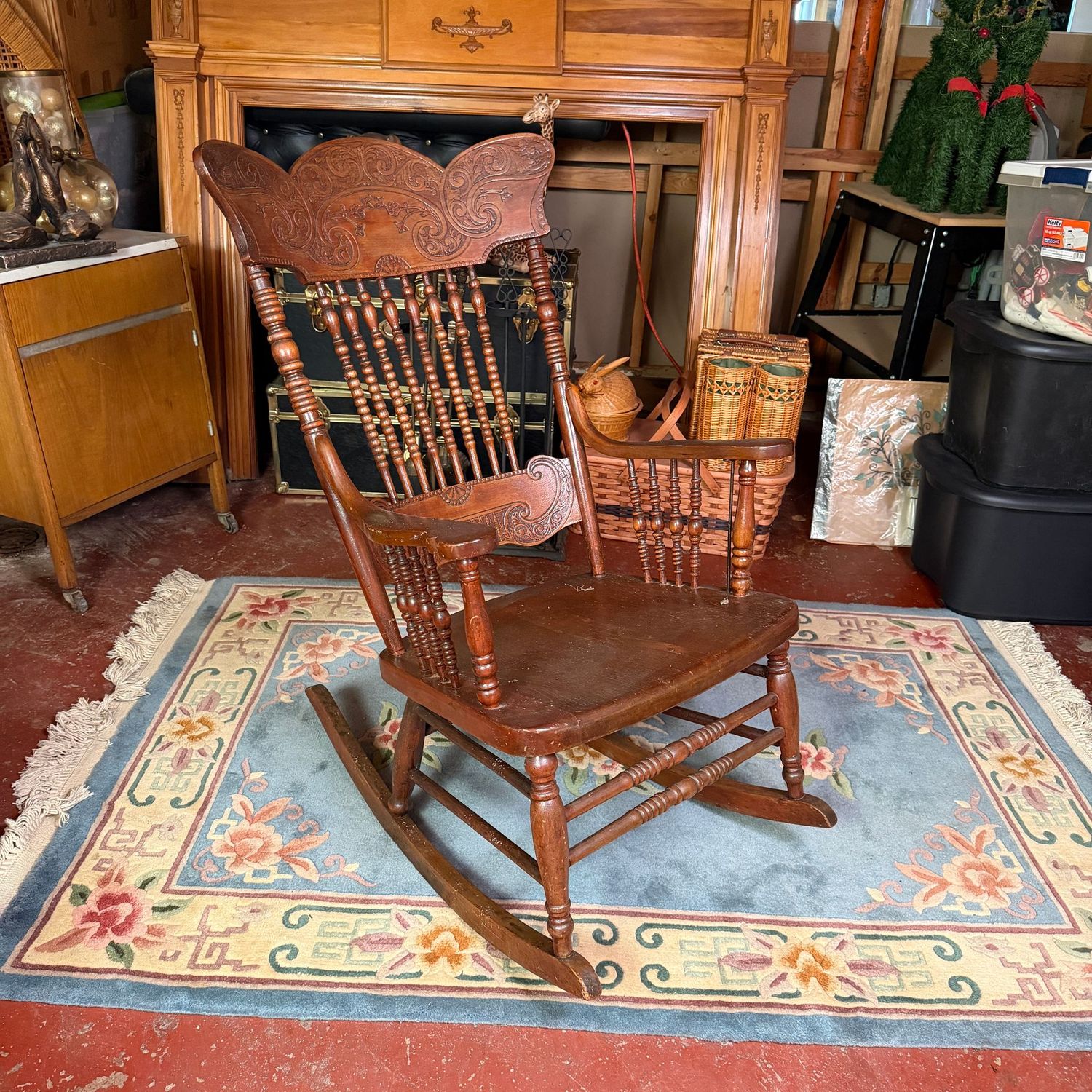 Large pressed-back turned spindle rocker, nice condition, with minor scratches, 42"H x 24"W (This item is heavy & in the lower level)