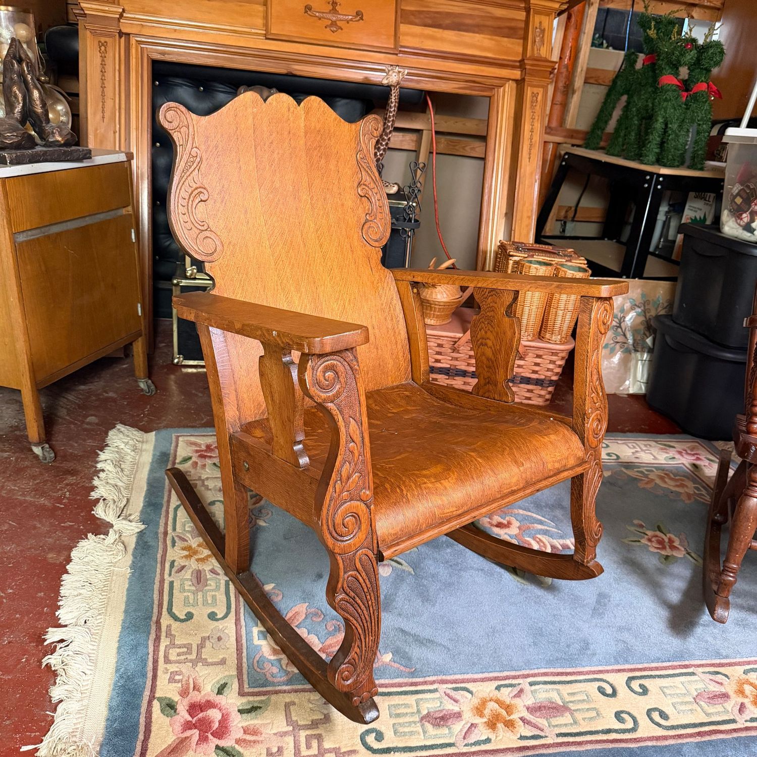 Large oak rocker with carved accents, beautiful construction, 36"H x 28"W (This item is heavy & in the lower level)
