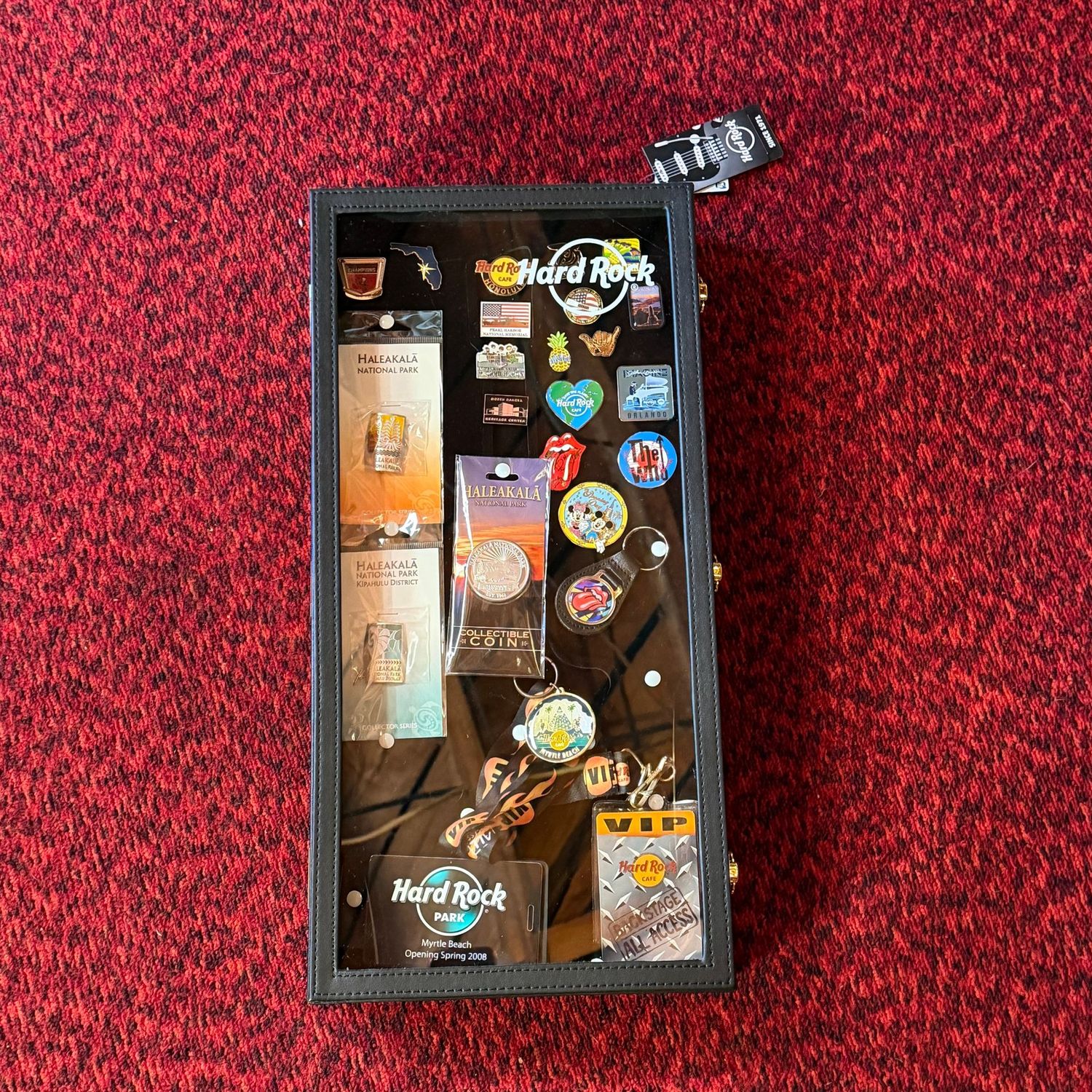 Hard Rock Cafe shadow box vinyl case with pins and memorabilia, 20" x 10"