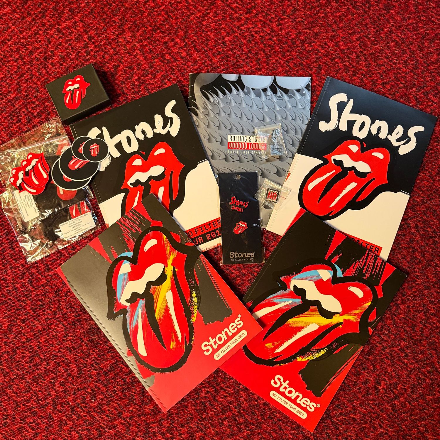 Rolling Stones memorabilia lot with stickers, pins, Voodoo Lounge and No Filter Tour programs