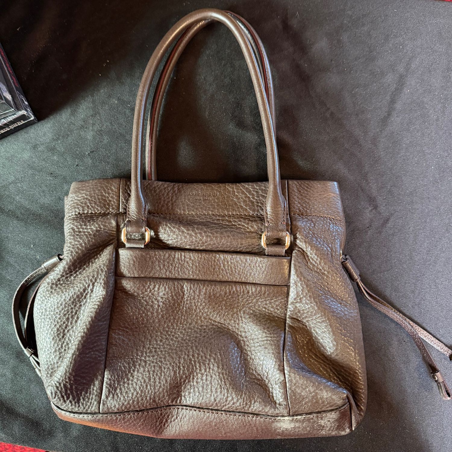 Kate Spade purse, minor wear, dark purple lining, magnetic closure, 9" x 12"