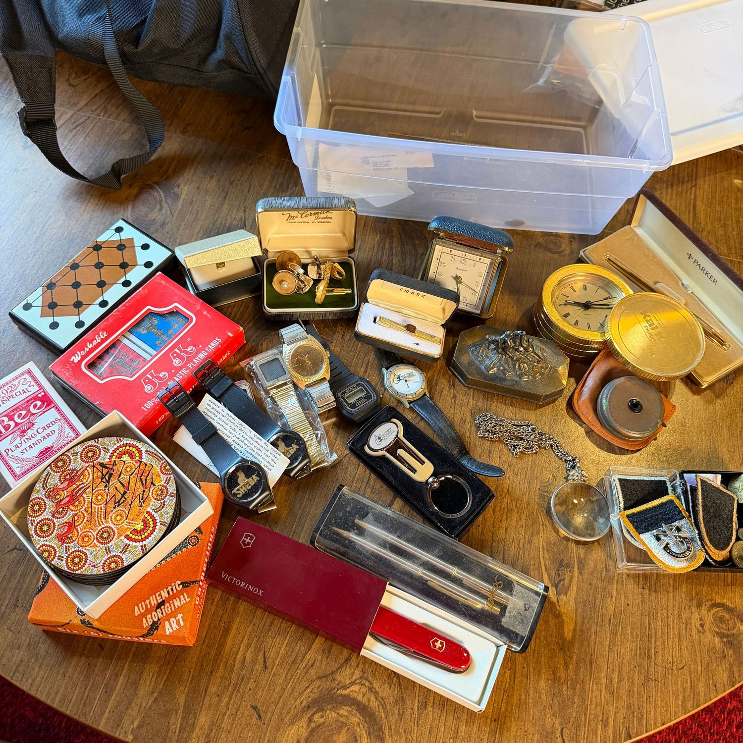 Small bin of pens, coasters, clocks, patches & more