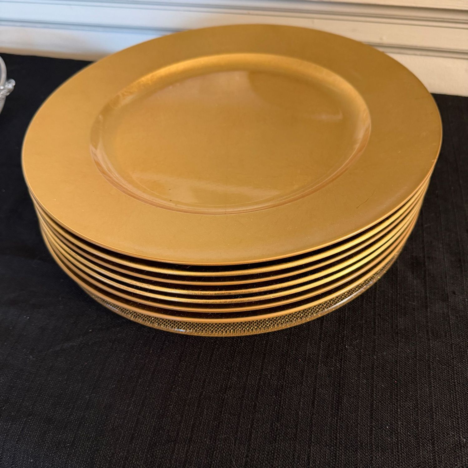 Group of 7 gold chargers and 1 mesh-pattern  charger