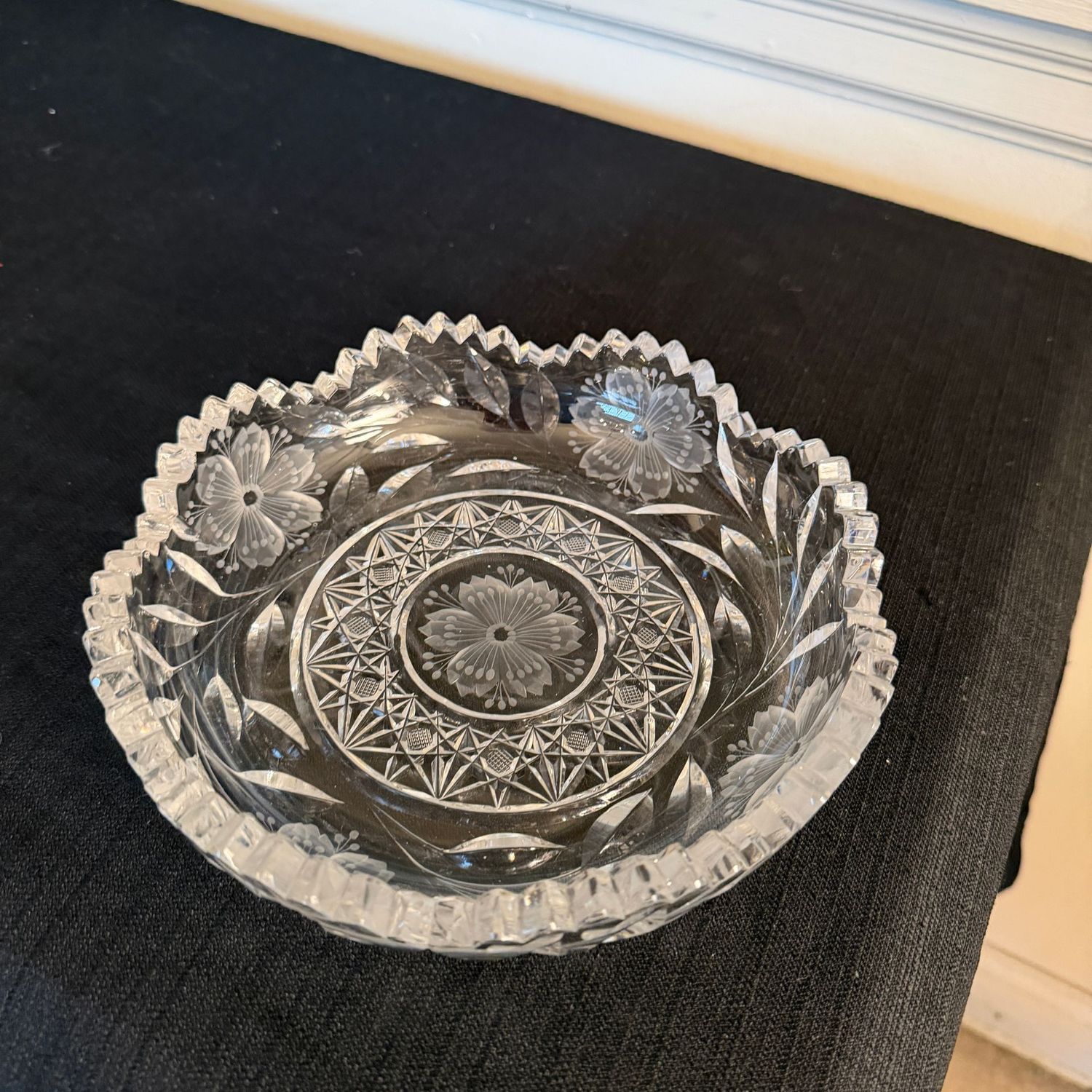 Cut and pressed lead crystal dish with crosshatched diamonds, flowers, and scalloped sawtooth rim, 8.5"W