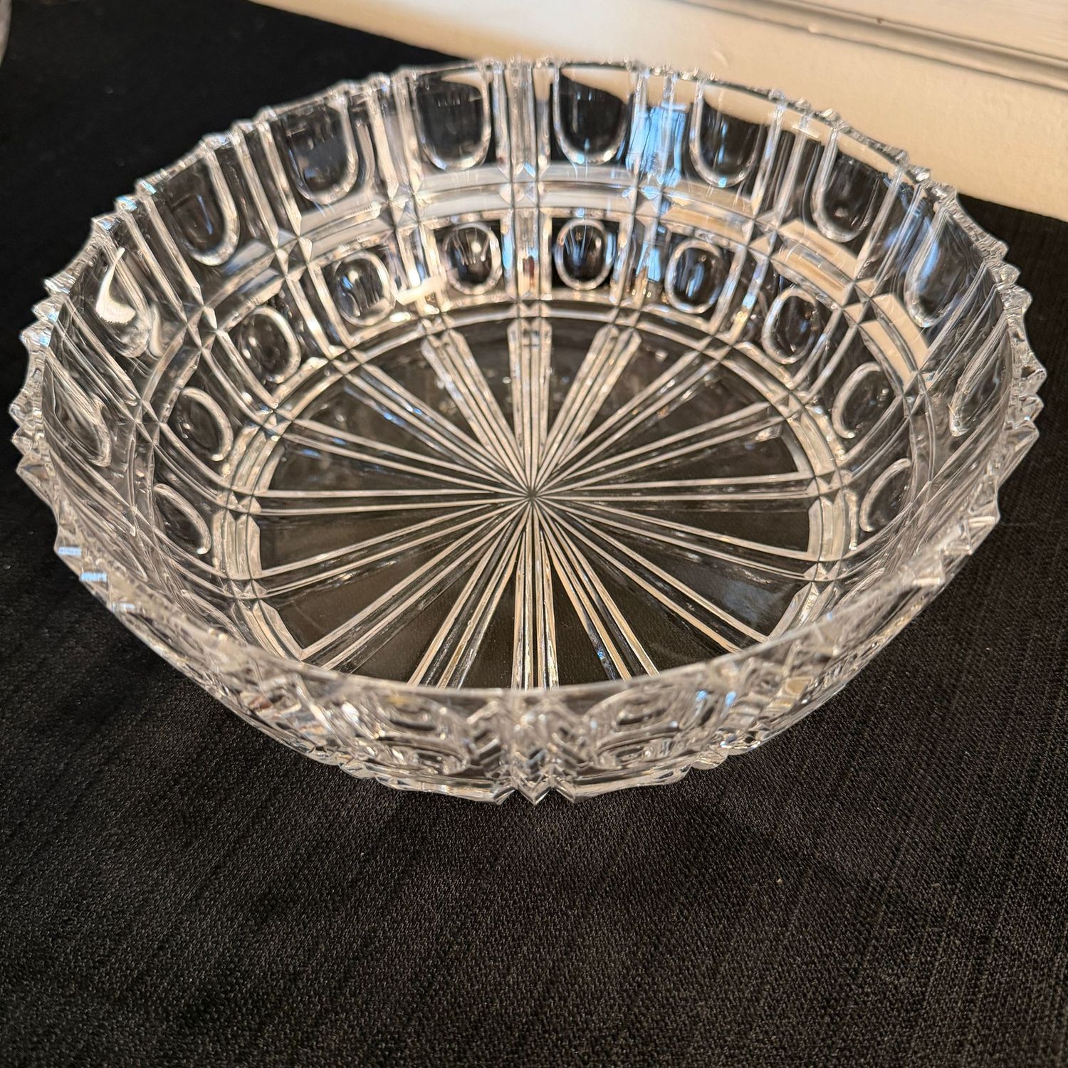 Lead crystal bowl with large starburst center and geometric paneled sides, 2.5"H x 9"W