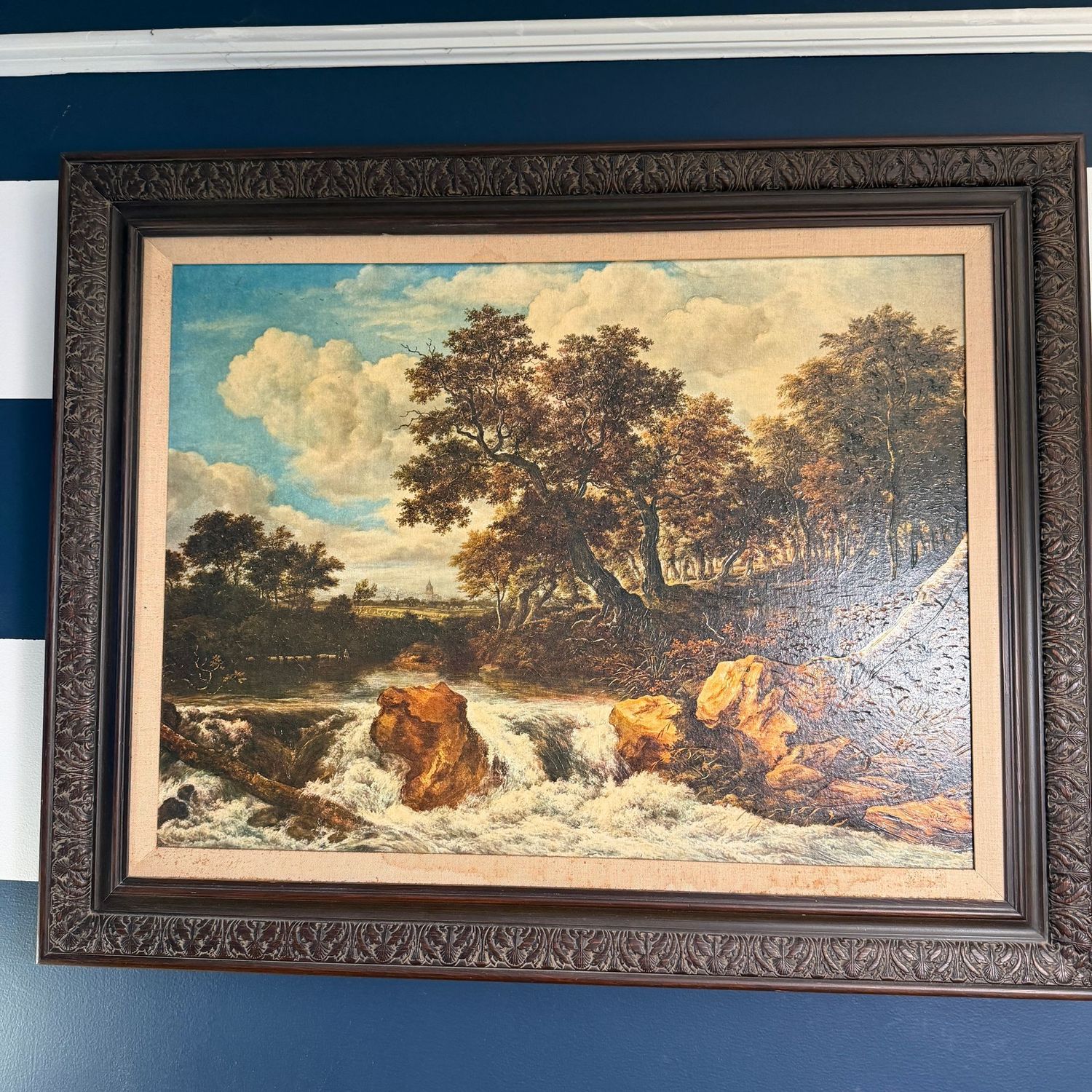 Large waterfall  lanscape print on canvas with dark wood frame, some wear, 32" x 41"