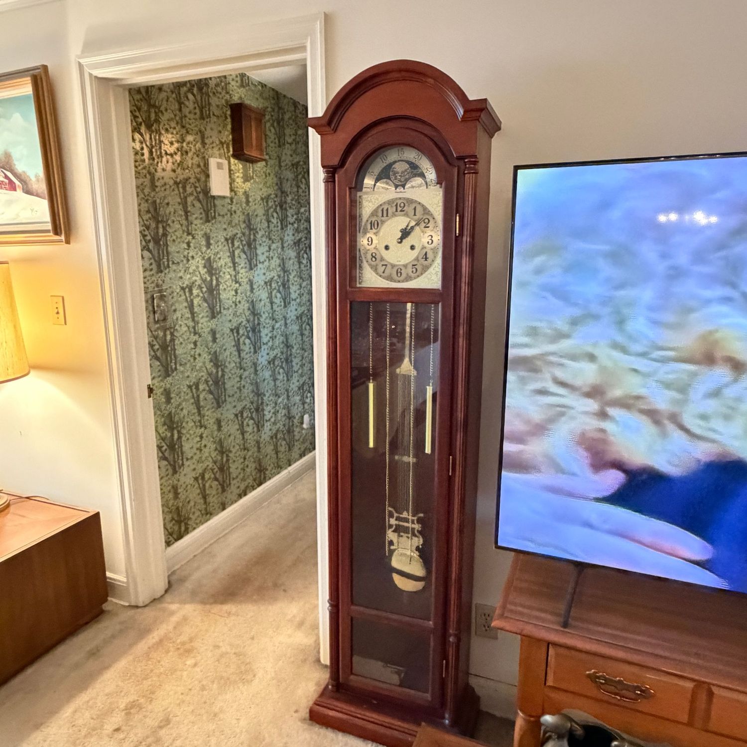 Moon-phase West Manor grandfather clock, works, minor bump to case on left and minor chips on bottom, approx. 6'4"H x 19"W x 10"D