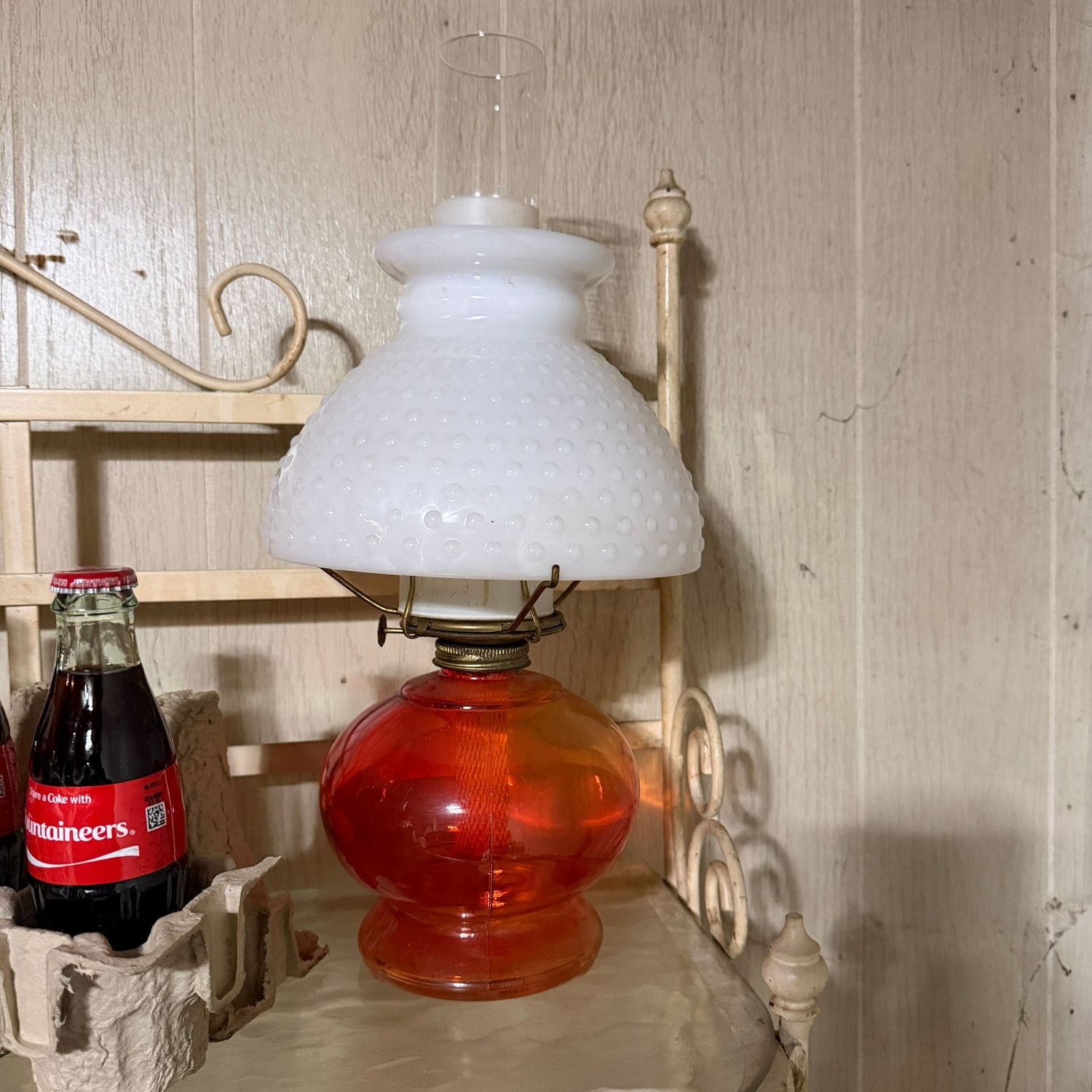 Orange-red oil lamp with hobnail milk glass shade, 20"H x 7.5"W