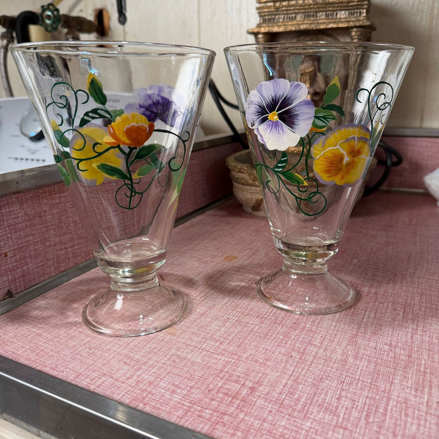 Pair of painted pansy Teleflora glass vases, 7"