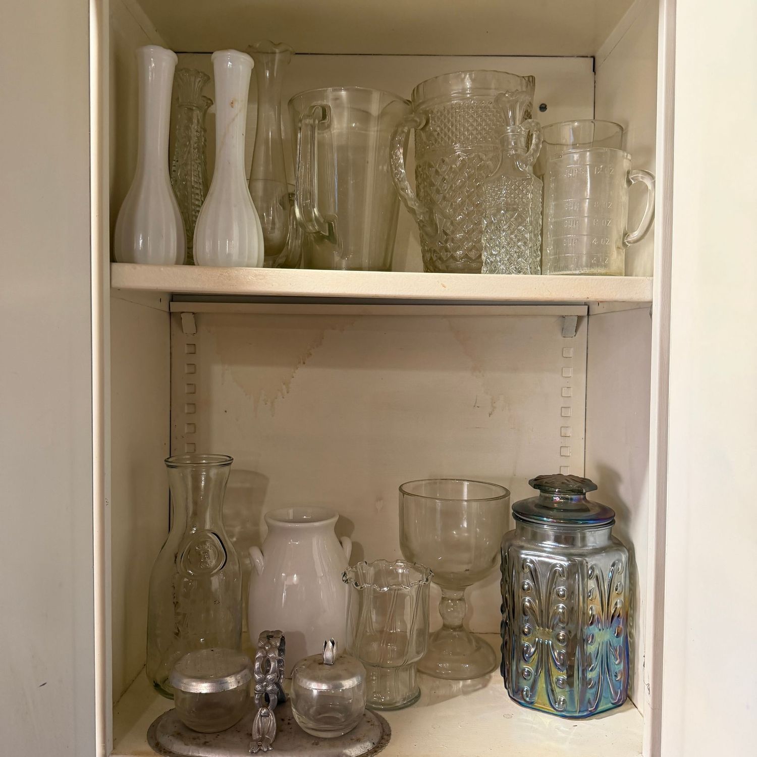Cabinet contents with pitchers, vases & more