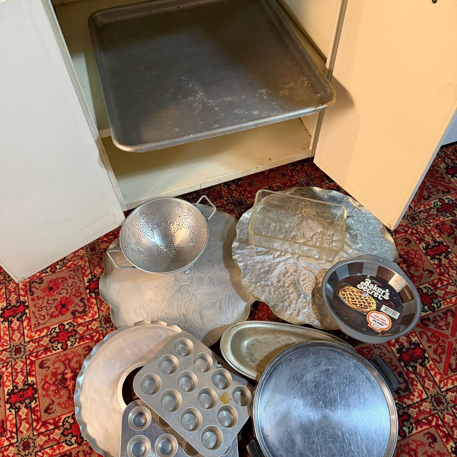 Cabinet contents of vintage baking and serving lot, the large tray is commercial size at 18" x 21"
