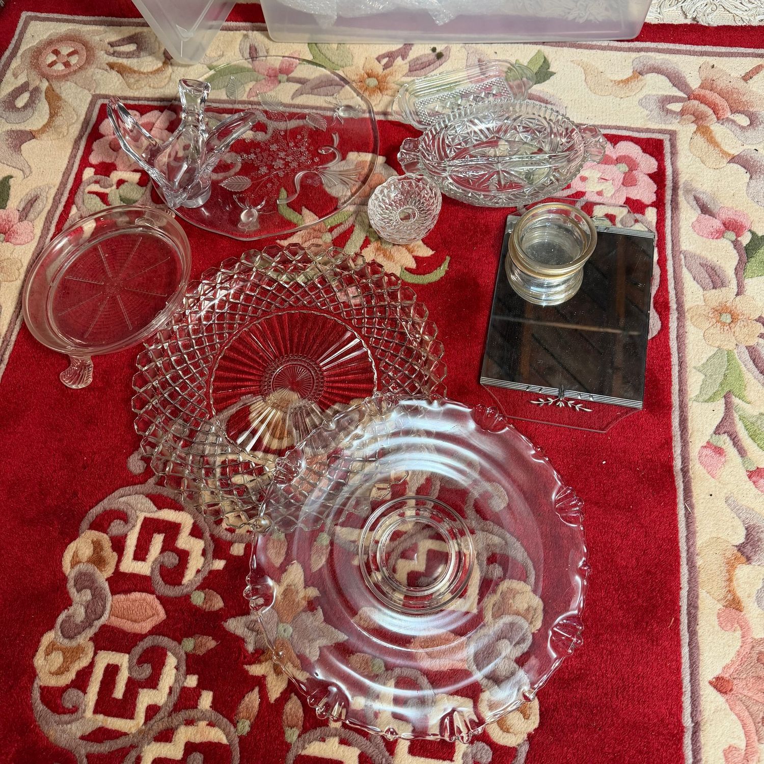 Clear bin with lid of clear glass trays, plate, dish and bird