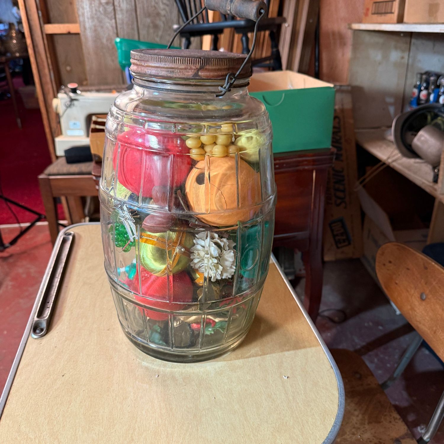 Vintage glass Wilson's jar with handle, filled with decorations,  14"H