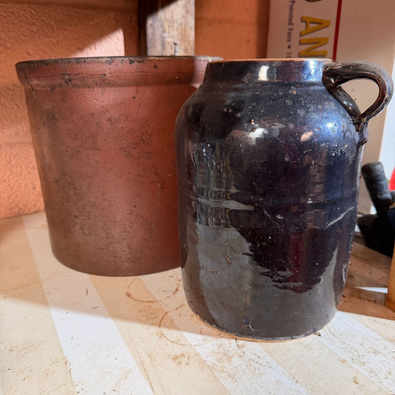 Two older stoneware pieces, both have been glued, 9"H