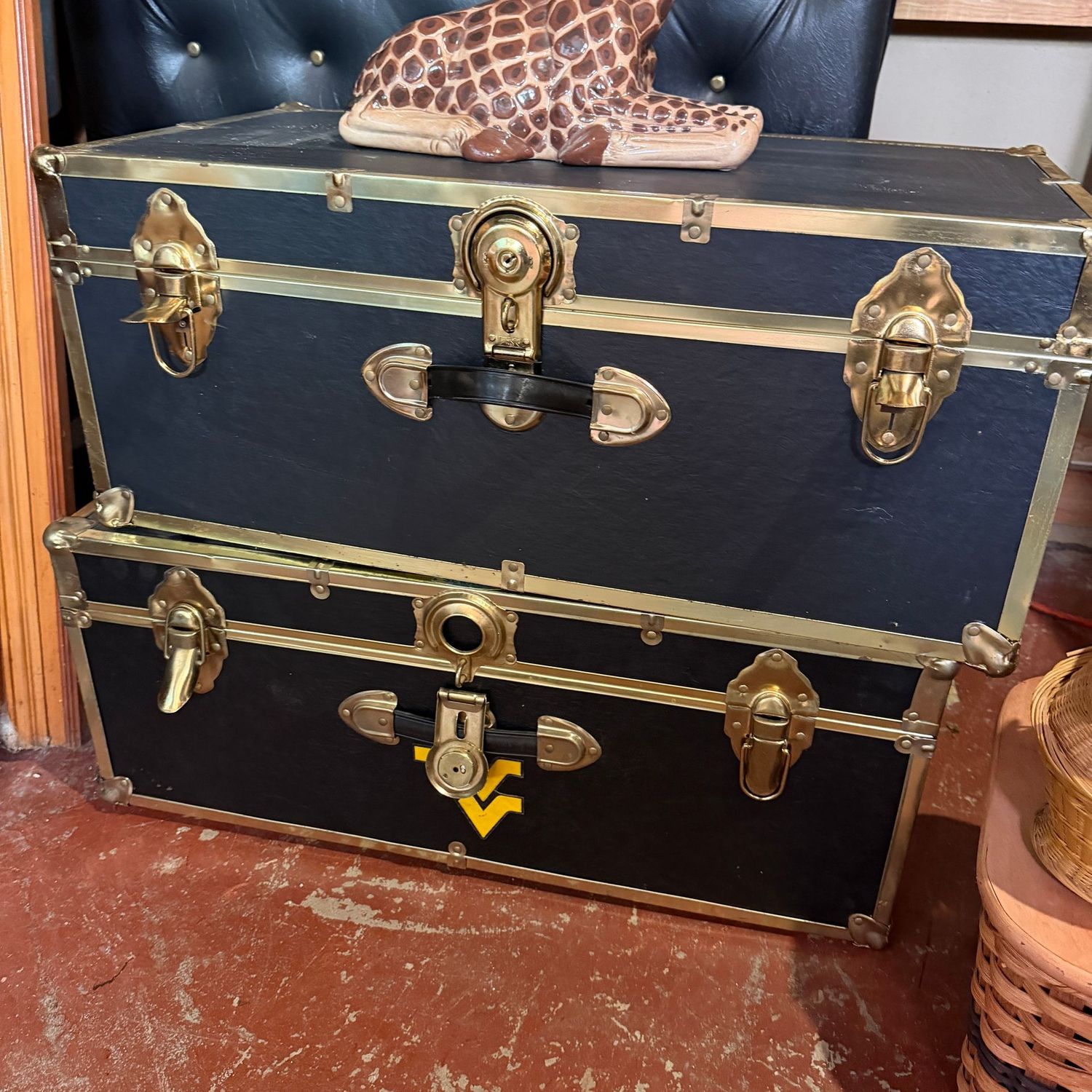 Two black footlockers, one is open, one is locked, no keys, good condition, 12"H x 30"L