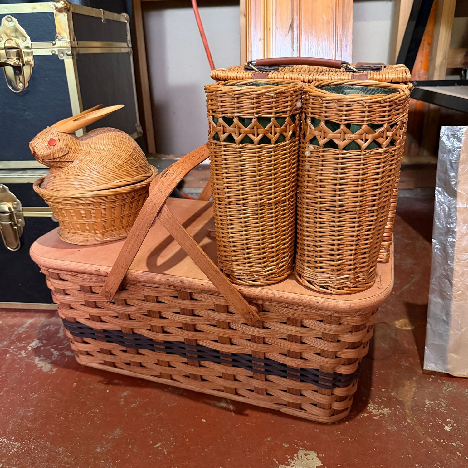 Group of baskets including a wine basket, bunny, and large picnic basket 18"L