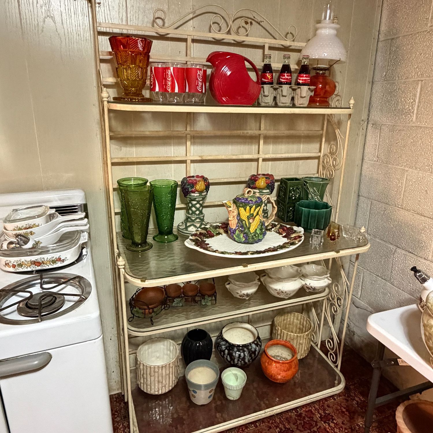 Large metal plant stand with marbled glass shelves, sturdy, metal may need repainting, 66"H x 43"W x 17"D (This item is heavy & in the lower level)