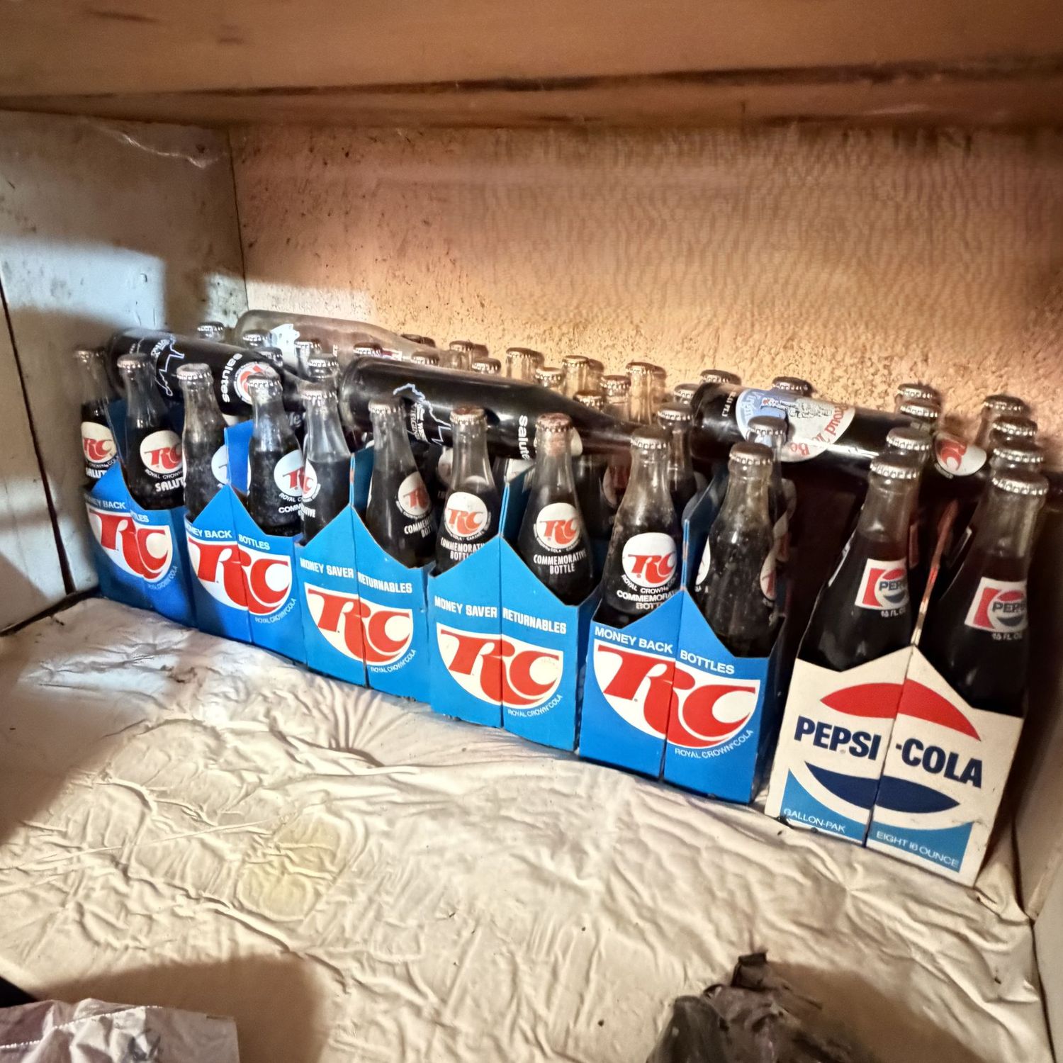 Entire shelf of vintage RC and Pepci bottles, most are filled & sealed, may have wear
