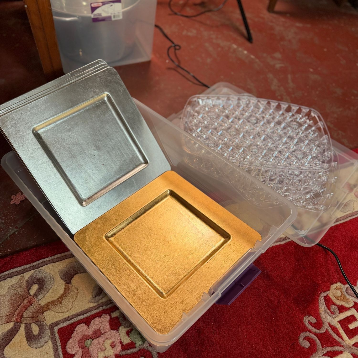 Clear bin with lid with square gold & silver chargers, clear plastic serving trays