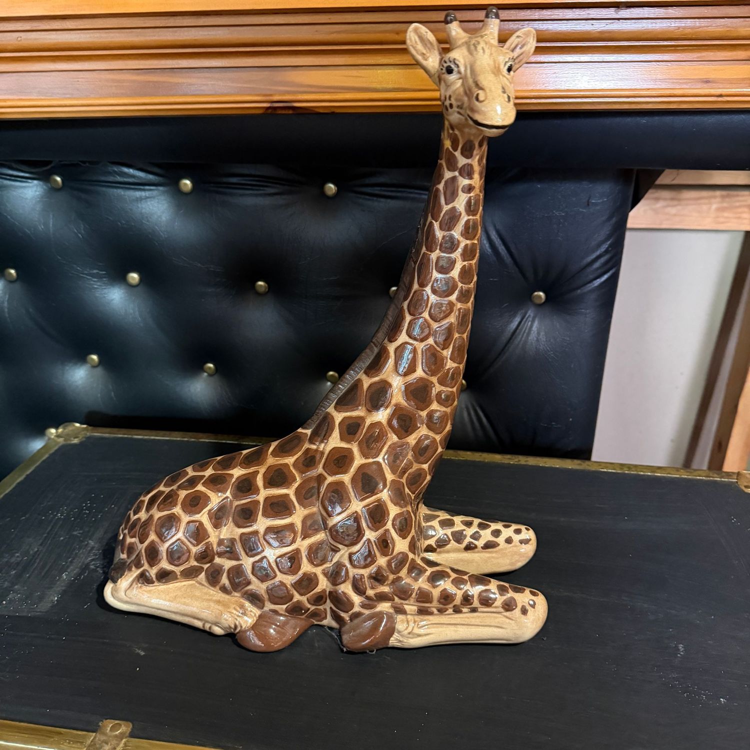 Tall ceramic seated giraffe, 16"H