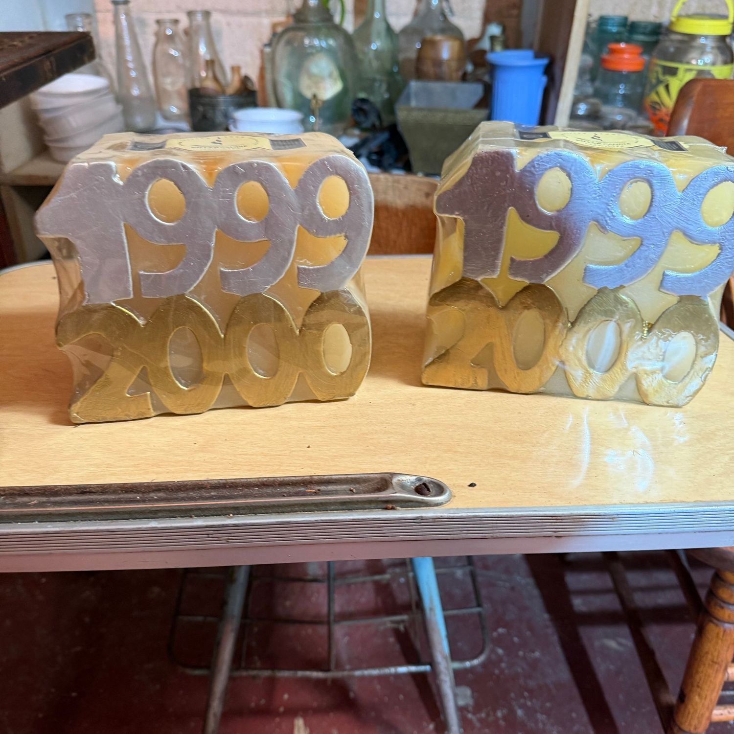 Two large 1999/2000 candles, unopened, 5"H