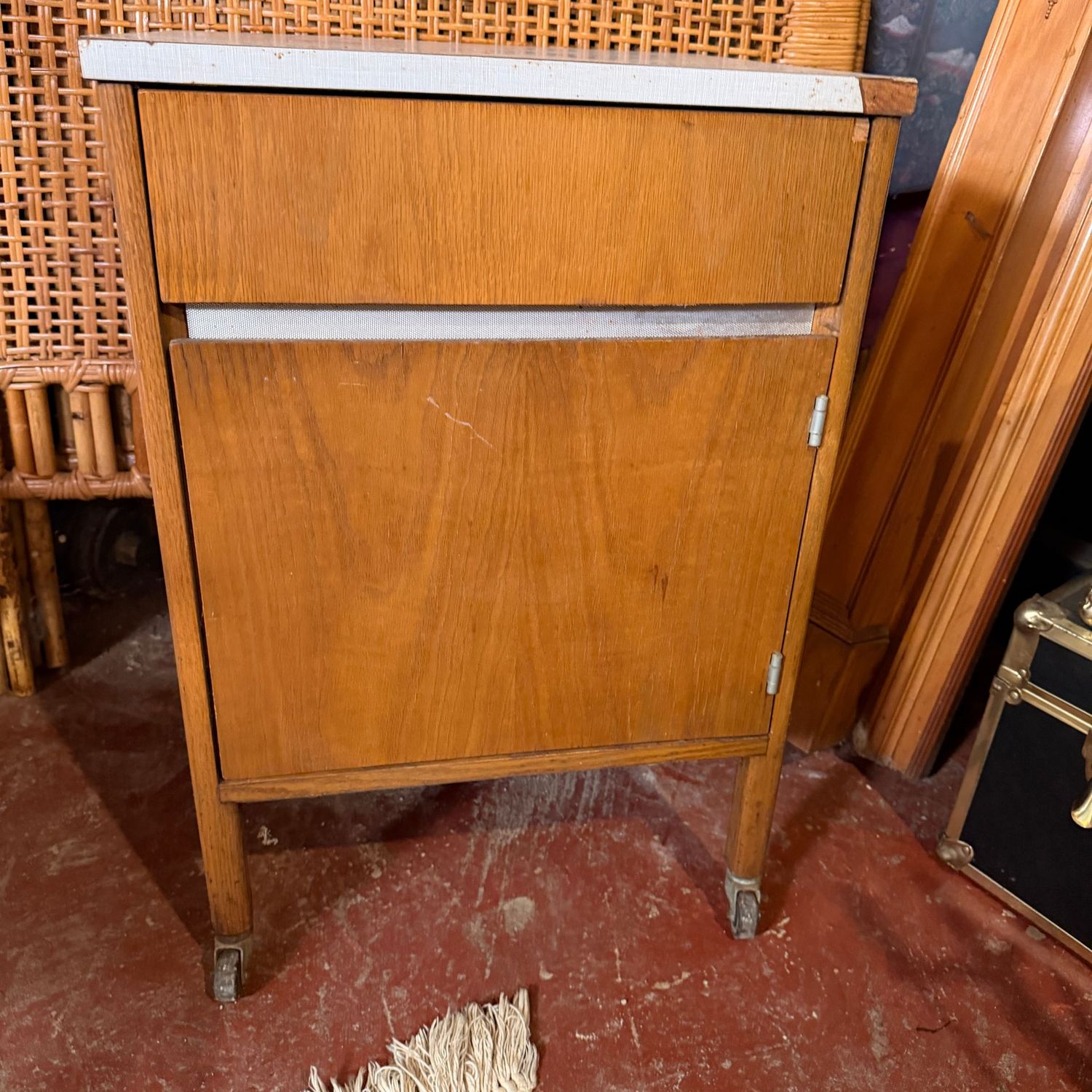 Vintage storage cabinet table on casters, some wear to veneer, sturdy, 29"H x 19"W x 17"D (This item is heavy & in the Lower Level)