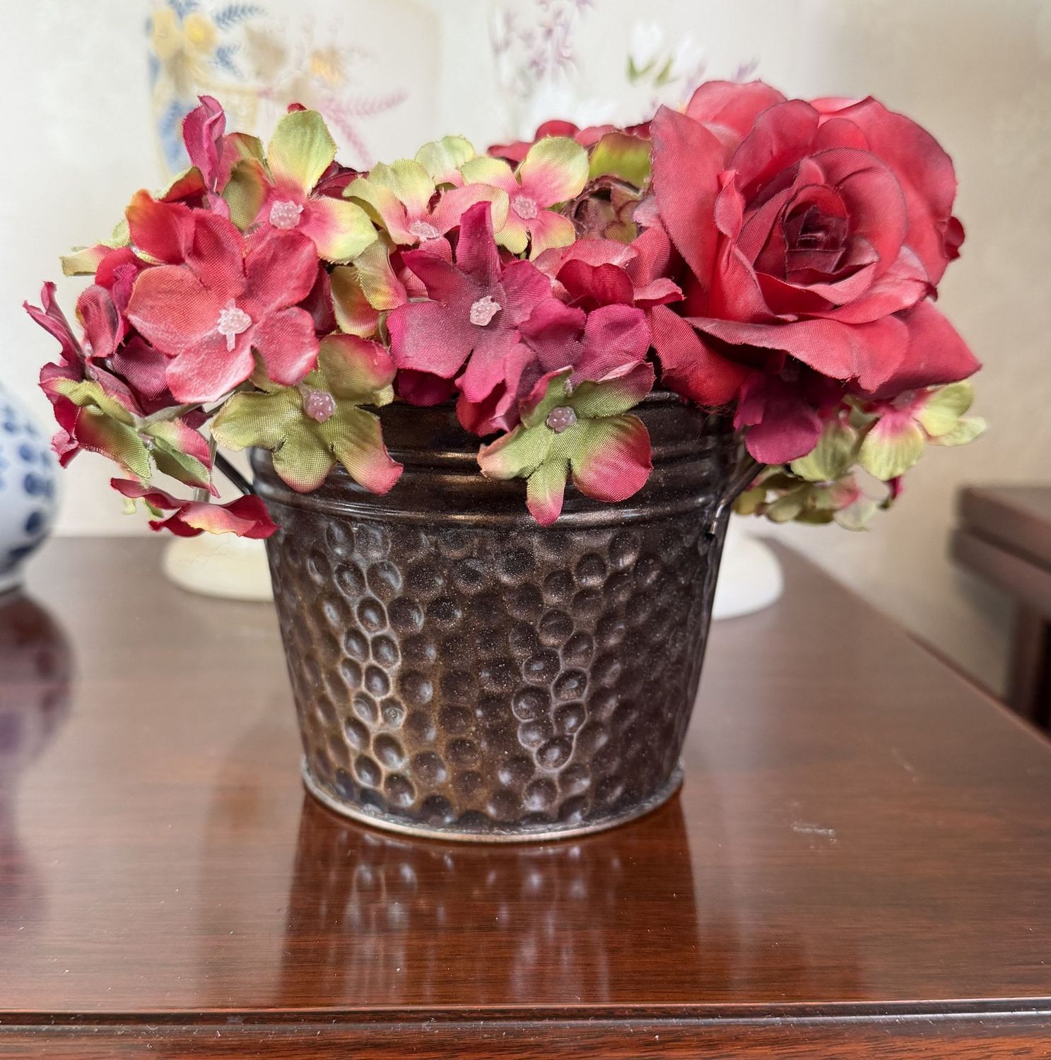 Petite dark pink floral arrangement in a lightweight metal planter, 5"H