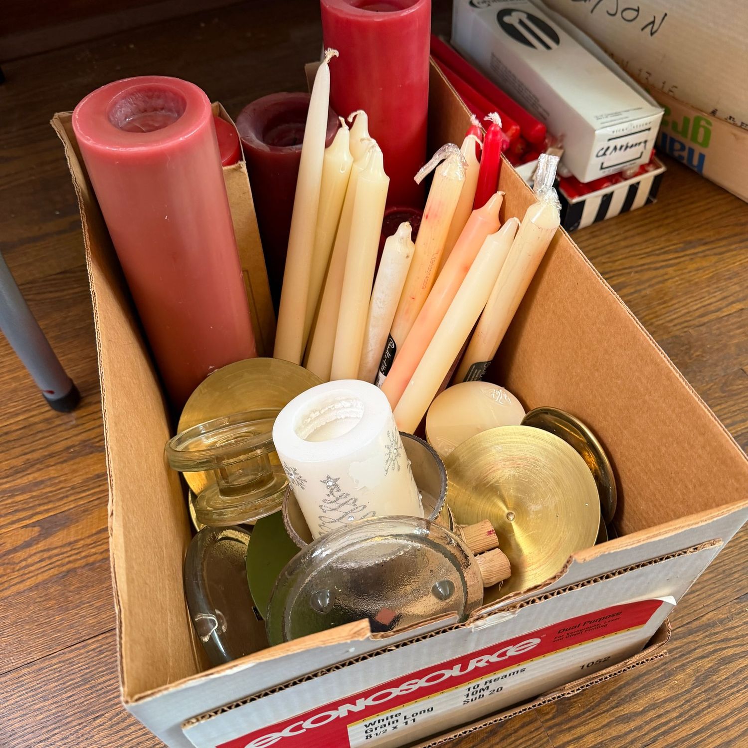 Box of taper and pillar candles, pillar candle holders/bases, some wear