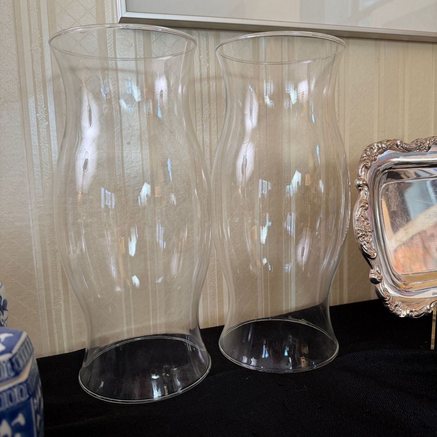 Two glass candle chimneys, hurricane candle shade, 11 Two glass candle chimneys, hurricane candle shade, 11"H, and should fit a candle holder base up to 4"W