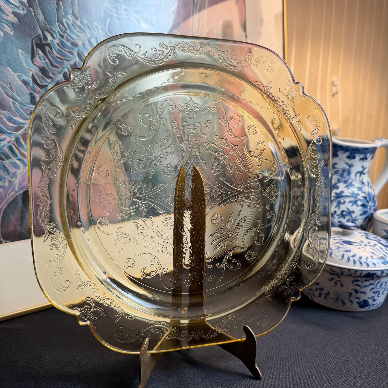Light yellow Indiana Glass dinner plate on brass stand