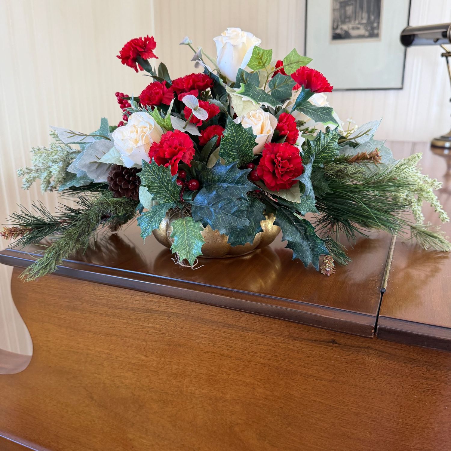 Holiday floral arrangement with roses, carnations, and holly, gold planter, 9 Holiday floral arrangement with roses, carnations, and holly, gold planter, 9"H x 20"W