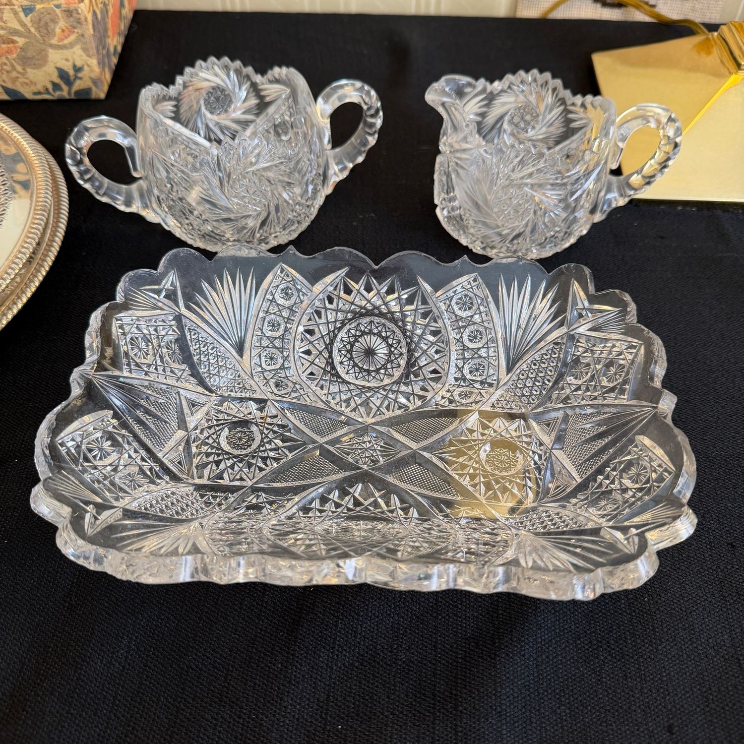 Cut crystal creamer, sugar, and a square dish 9 Cut crystal creamer, sugar, and a square dish 9" x 6", all have some chips to edges